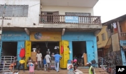 FILE - The Arwa clinic, center, that was closed after the clinic Doctor got infected by the Ebola virus in the capital city of Freetown, Sierra Leone, July 15, 2014..