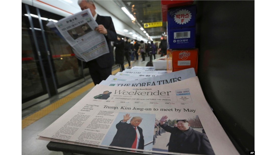 A newspaper with headline telling of a planned summit meeting between North Korean leader Kim Jong Un and U.S. President Donald Trump is displayed at a subway station in Seoul, South Korea, March 10, 2018.