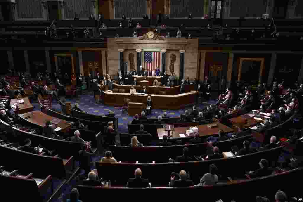 Speaker of the House Nancy Pelosi, D-Calif., and Vice President Mike Pence officiate as a joint session of the House and Senate convenes to confirm the Electoral College votes cast in November&#39;s election, at the Capitol in Washington.