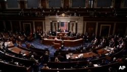 FILE - House Speaker Nancy Pelosi, D-Calif., and Vice President Mike Pence officiate as a joint session of Congress convenes to confirm the Electoral College votes cast in November's election, at the Capitol in Washington, Jan. 6, 2021.