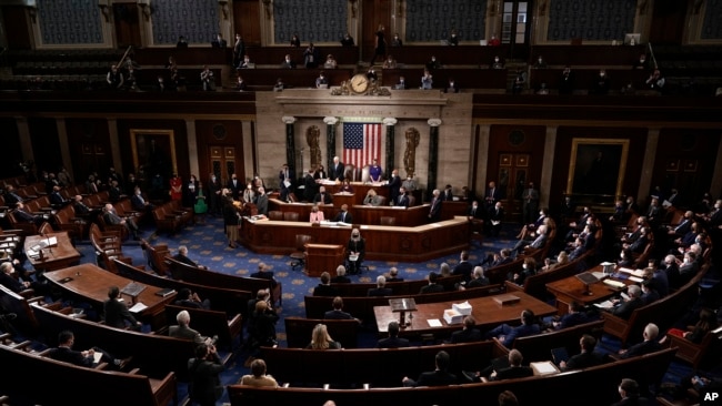 FILE - Speaker of the House Nancy Pelosi and Vice President Mike Pence officiate as a joint session of the House and Senate convenes to confirm the Electoral College votes cast in the November 2020 election, at the Capitol in Washington, Jan. 6, 2021.