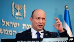 FILE - Israeli Prime Minister Naftali Bennett speaks during a news conference, in Jerusalem, Aug. 18, 2021. 