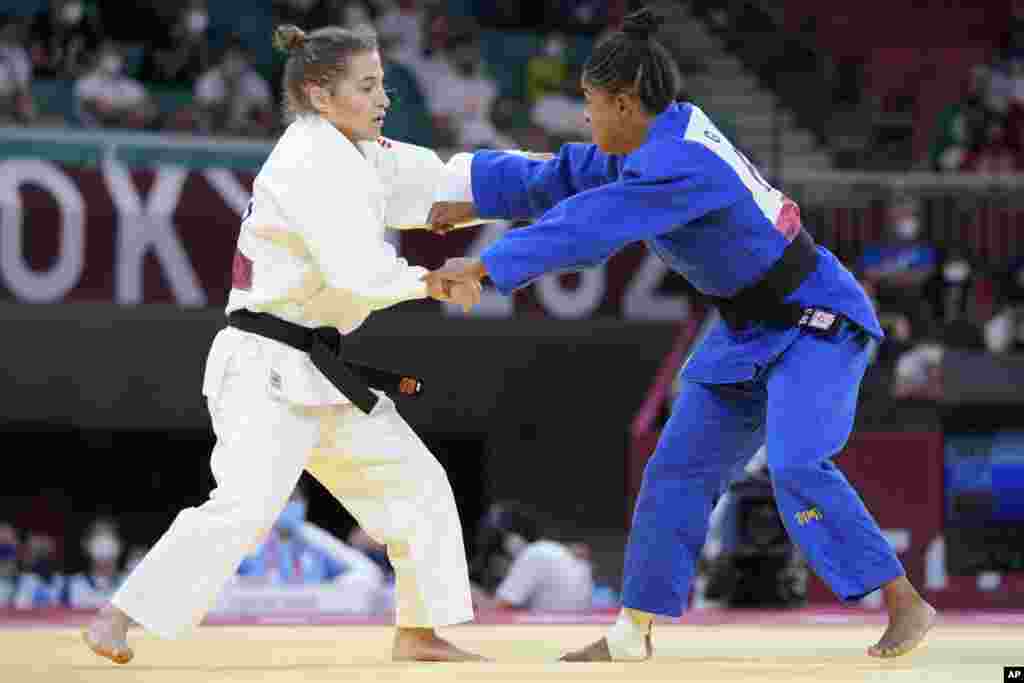 Paula Pareto of Argentina, left, and Geronay Whitebooi of South Africa compete during their women&#39;s -48kg round of 32 judo match at the 2020 Summer Olympics, Saturday, July 24, 2021, in Tokyo, Japan. (AP Photo/Vincent Thian)