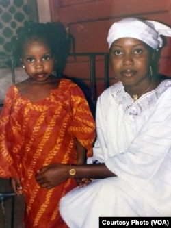 Maya Hughes, left, and Zainab Sesay pose during their time in Sierra Leone. A medical emergency forced Maya to leave the country a month before Zainab. They later reunited in the United States.
