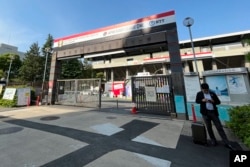 The entrance of Prince Chichibu Memorial Rugby Stadium at an area known as Jingu Gaien is seen Friday, May 12, 2023, in Tokyo. (AP Photo/Stephen Wade)