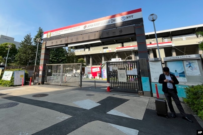 The entrance of Prince Chichibu Memorial Rugby Stadium at an area known as Jingu Gaien is seen Friday, May 12, 2023, in Tokyo. (AP Photo/Stephen Wade)