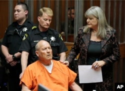 Joseph James DeAngelo, 72, who authorities suspect is the so-called Golden State Killer responsible for at least a dozen murders and 50 rapes in the 1970s and 80s, is accompanied by Sacramento County Public Defender Diane Howard, right, as he makes his first appearance, April 27, 2018, in Sacramento County Superior Court in Sacramento, Calif.