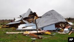 FILE - Damage to the home where Daniel and Zuleyma Santillano lived with their newborn and three older children in Blue Ridge, Texas, north of Dallas, Dec. 27, 2015.