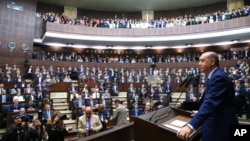 Turkey's President Recep Tayyip Erdogan, talks to members of the ruling Justice and Development party in Ankara, Turkey, June 13, 2017. Erdogan reiterated his country's position to support Qatar.