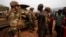 Angry young men complain to French soldiers on patrol in the pro-Christian area of Bangui February 15, 2014