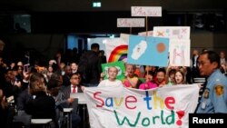 Children are seen during climate march prior to the opening session of the COP23 U.N. Climate Change Conference 2017, hosted by Fiji but held in Bonn, in World Conference Center Bonn, Germany, Nov. 6, 2017. 