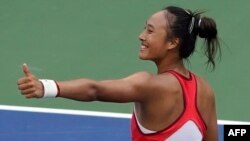 China's Zheng Qinwen celebrates after victory against Tunisia's Ons Jabeur during the US Open tennis tournament women's singles round of 16 match at the USTA Billie Jean King National Tennis Center in New York City, on Sept. 4, 2023.
