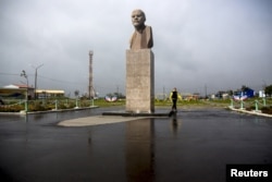 FILE – A statue of Soviet state founder Vladimir Lenin towers in Yuzhno-Kurilsk, the main settlement on what Russians call the southern Kuril island of Kunashir.