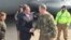 FILE - U.S. Defense Secretary Ash Carter greets Army Lt. Gen. Sean MacFarland after arriving in Baghdad, Dec. 16, 2015. 