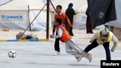 Syrian refugee children play soccer at a youth empowerment center at al Zaatri refugee camp in the Jordanian city of Mafraq, near the border with Syria, Feb 25, 2013. (Reuters)