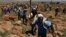 Miners sing during their strike at the AngloGold Ashanti Mine in Fochville, near Johannesburg, South Africa on Oct. 18, 2012. 