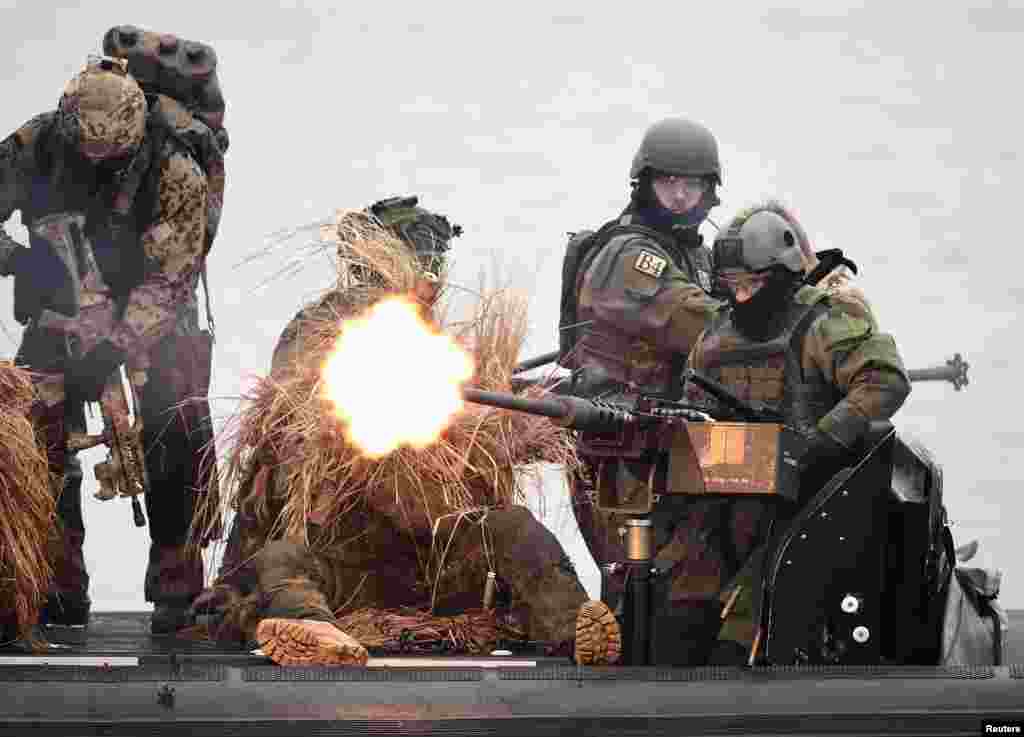 Combat divers "Kampfschwimmer" of German special naval forces are seen on a boat during a presentation by the German Army "Bundeswehr" in Eckernfoerde, Schleswig-Holstein.