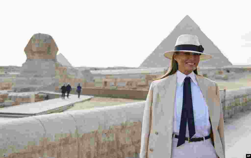 First lady Melania Trump visits the ancient statue of Sphinx, with the body of a lion and a human head, at the historic site of Giza Pyramids in Giza, near Cairo, Egypt, Oct. 6, 2018.