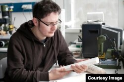 Paleo-climatologist Thomas Felis in his laboratory at the Center for Marine Environmental Sciences University of Bremen Germany inspects core samples from the Great Barrier Reef dating from the peak of the last ice age 20,000 years ago. (Credit: Volker Di