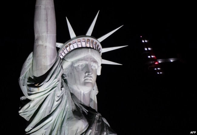 Solar Impulse 2 landed in New York early June 11, after flying by the Statue of Liberty at the end of the US portion of its bid to circle the globe using only solar power. (AFP PHOTO / Don EMMERT)