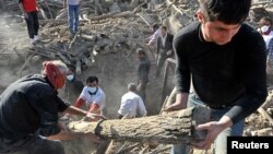 Rescue teams search for victims in the earthquake-stricken village of Varzaqan near Ahar, in East Azerbaijan province, August 12, 2012.