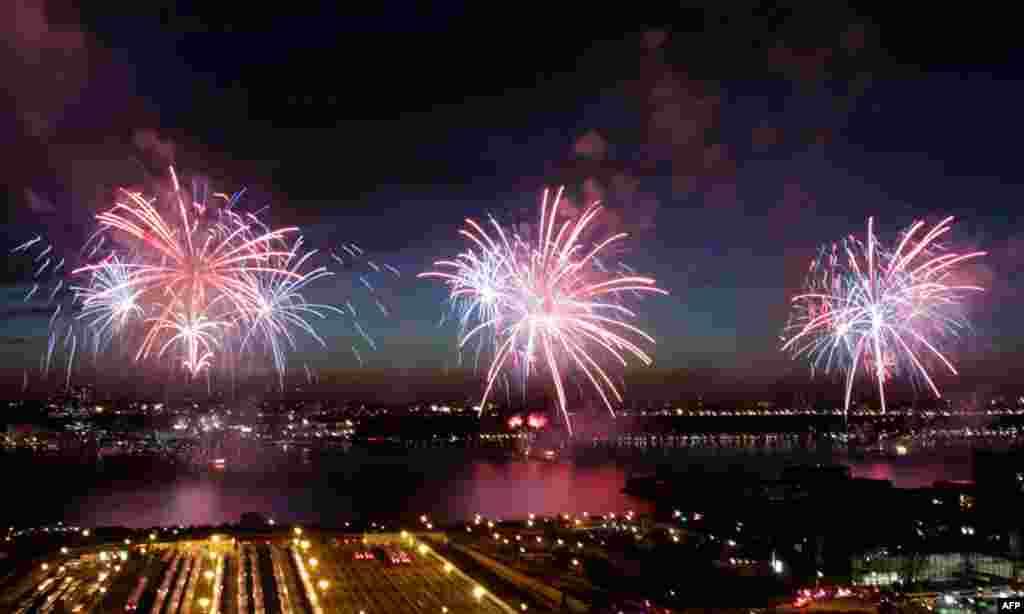 Fireworks explode over the Hudson River in New York, Monday, July 4, 2011. (AP Photo/Seth Wenig)