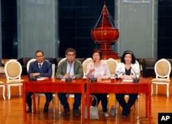 U.N. Security Council President Gustavo Meza-Cuadra, center left, Poland's U.N. envoy Joanna Wronecka, center right, Kuwait's U.N. envoy Mansour Ayyad al-Otaibi, left, and Britain's U.N. envoy Karen Pierce, right, hold a press conference at Naypyitaw International Airport in Naypyitaw, Myanmar, May 1, 2018, after a two-day visit to Myanmar.