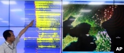 Earthquake and Volcano of the Korea Monitoring Division Director Ryoo Yong-gyu speaks in front of a screen showing seismic waves that were measured in South Korea, in Seoul, South Korea, Sept. 9, 2016.