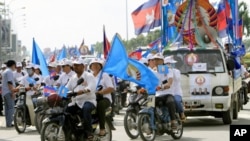 Supporters of the ruling Cambodian People's Party campaign during a commune elections rally in Phnom Penh, Cambodia, Friday, May 18, 2012. The campaign was kicked off Friday for the June 3 commune elections. 