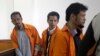 FILE - Suspected militants Abdul Hakim (from left), Ahmad Junaedi and Tuah Febriwansyah attend trial at West Jakarta District Court in Jakarta, Indonesia, Oct. 12, 2015.