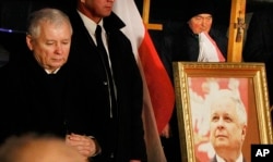FILE - Jaroslaw Kaczynski leader of ruling party Law and Justice Party attends a remembrance ceremony for the 2010 plane crash that killed Poland's President Lech Kaczynski and 95 others in Smolensk, in front of the Presidential Palace in Warsaw, Poland, Thursday, March 10, 2016.