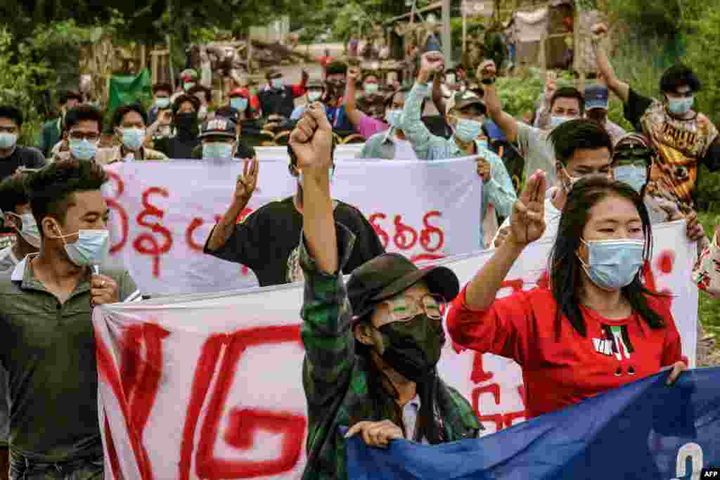 Protesters march during a demonstration against the military coup in Mandalay, in this photo taken and received from an anonymous source via Facebook.