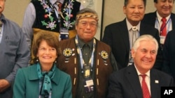 U.S. Secretary of State Rex Tillerson (seated right) and U.S. Sen. Lisa Murkowski pose with Nulato Chief Mickey Stickman at an Arctic Council event in Fairbanks, Alaska. 