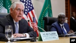 U.S. Secretary of State Rex Tillerson holds a news conference with African Union (AU) Commission Chairman Moussa Faki, of Chad, after their meeting at African Union headquarters, Thursday, March 8, 2018 in Addis Ababa, Ethiopia.