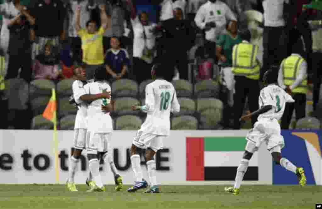 Nigeria's Musa Yahaya, left, celebrates scoring the opening goal with his teammates against Mexico during the World Cup U-17 final soccer match between Nigeria and Mexico at Mohammad Bin Zayed stadium in Abu Dhabi, United Arab Emirates, Friday, Nov. 8, 20