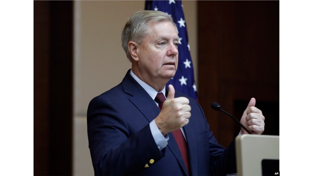 Republican Sen. Lindsey Graham gestures as he speaks to reporters in Ankara, Turkey, Jan. 19, 2019.