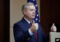 Republican Sen. Lindsey Graham gestures as he speaks to reporters in Ankara, Turkey, Jan. 19, 2019.