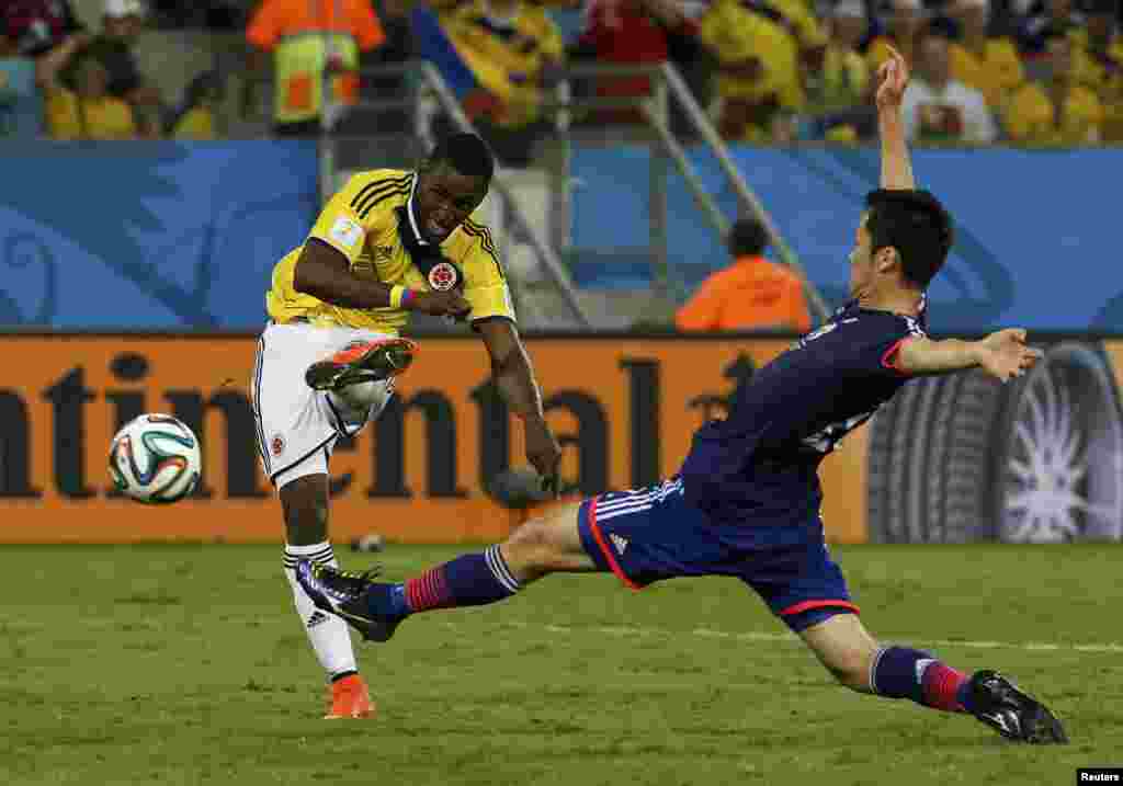 Colombia's Jackson Martinez scores his second goal of the match between Japan and Colombia at the Pantanal arena in Cuiaba, June 24, 2014.