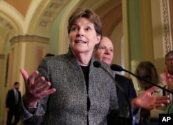 FILE - Sen. Jeanne Shaheen speaks to reporters on Capitol Hill in Washington, Oct. 24, 2017.