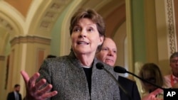 FILE - Sen. Jeanne Shaheen speaks to reporters on Capitol Hill in Washington, Oct. 24, 2017.