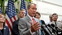 As Congress returns to work following the July 4th break and the Supreme Court decision to uphold President Obama's health care law, House Speaker John Boehner of Ohio, center, and other GOP House leaders face reporters after a closed-door political strat