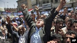An anti-government protester reacts during a demonstration demanding the resignation of Yemeni President Ali Abdullah Saleh, in Sanaa, May 2 2011