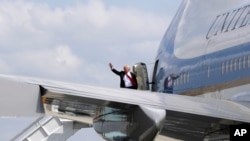 FILE - President Donald Trump waves as he boards Air Force One. Trump arrives in Israel Monday for a two-day visit, following a stop in Saudi Arabia.