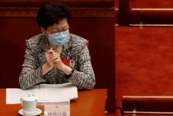 Hong Kong Chief Executive Carrie Lam wearing a face mask following the coronavirus disease (COVID-19) outbreak attends the opening session of the National People's Congress (NPC) at the Great Hall of the People in Beijing, China May 22, 2020
