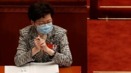 Hong Kong Chief Executive Carrie Lam wearing a face mask following the coronavirus disease (COVID-19) outbreak attends the opening session of the National People's Congress (NPC) at the Great Hall of the People in Beijing, China May 22, 2020