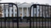 The White House is seen behind security barriers in Washington, March 24, 2019.