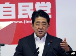 FILE - Japanese Prime Minister and leader of the ruling Liberal Democratic Party, Shinzo Abe, speaks during a press conference in Tokyo.