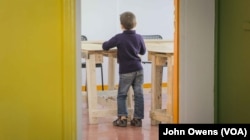 A youngster is shown in one of the Khora center’s classrooms, where Greek and English language lessons are taught, in the Exarchia district in Athens, Greece, Oct. 24, 2016.