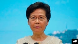 Hong Kong Chief Executive Carrie Lam listens to reporters' questions during a press conference in Hong Kong, Tuesday, July 7, 2020. TikTok says it will stop operations in Hong Kong, joining other social media companies.