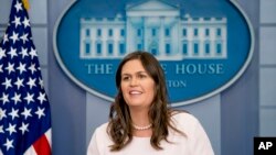 Description: White House press secretary Sarah Huckabee Sanders smiles while speaking to the media during the daily press briefing at the White House, Monday, June 4, 2018, in Washington.
